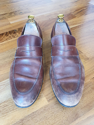 Dull pair of scuffed brown Harrys of London loafers